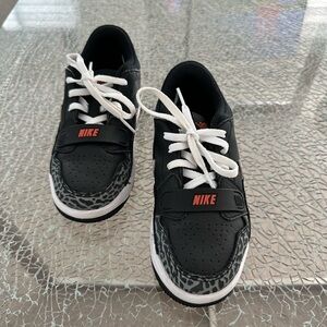 Nike Kids Black Sneakers with Red Logo